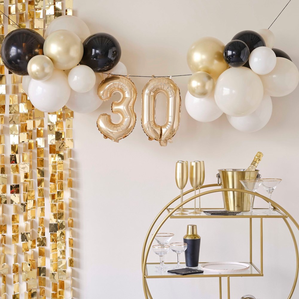 Milestone Balloon bunting decorations with mini foil numbers 30 and black, white and gold latex balloons