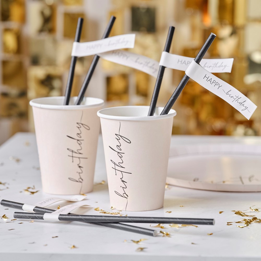 Ginger Ray Champagne Nude & Black Happy Birthday Paper Straws on table