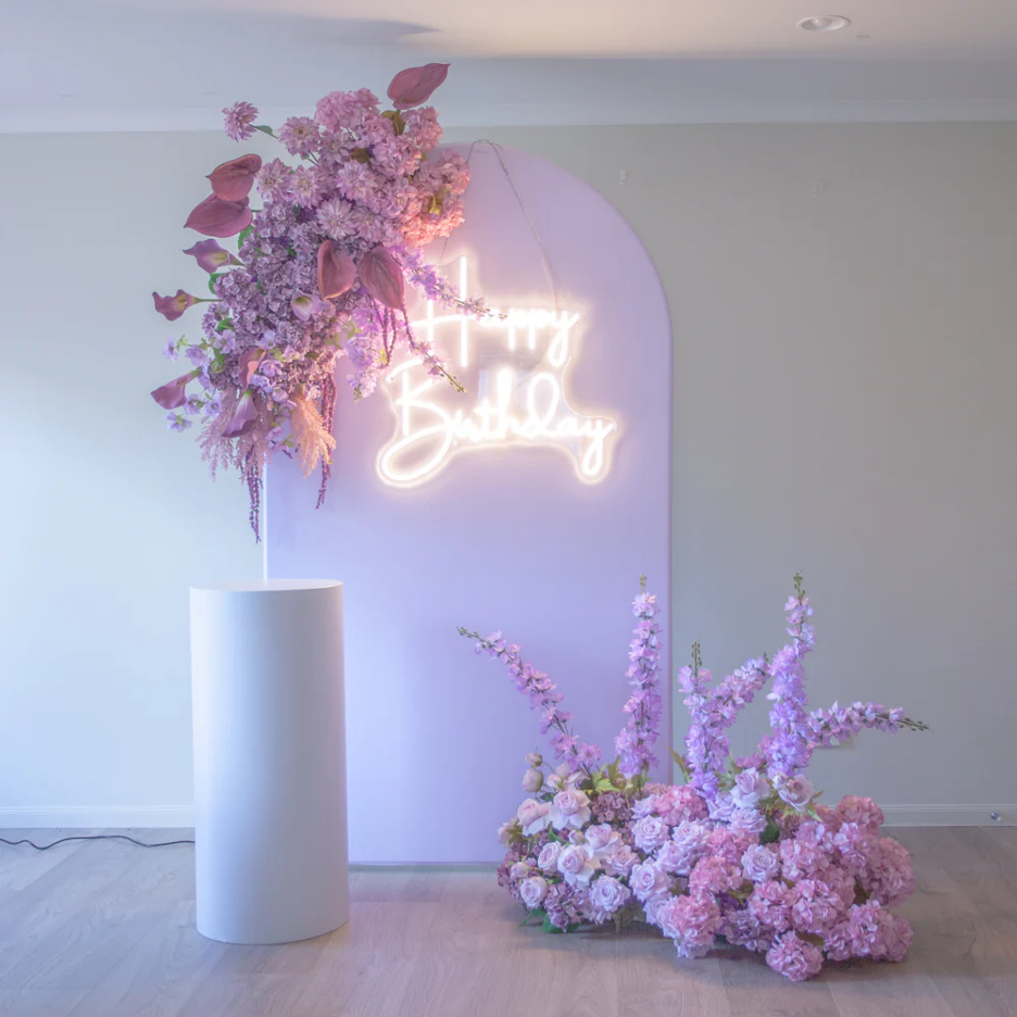: Pink arch backdrop with purple & pink floral bundle