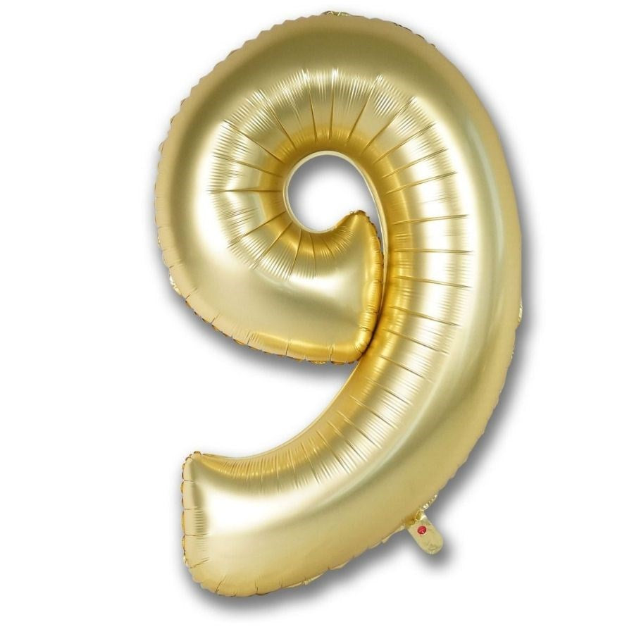 Gold number 9 balloon on a white background