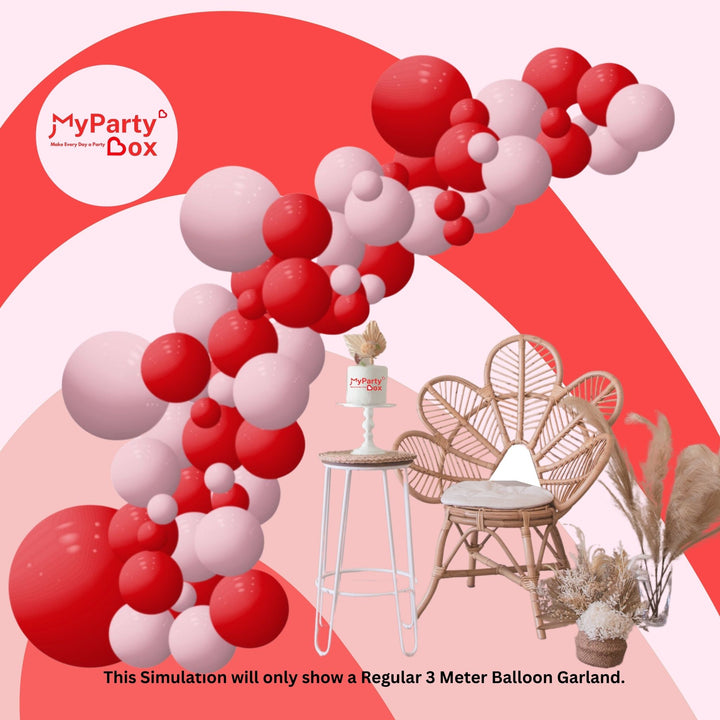 Red and pink balloon garland with chairs and decorative items.