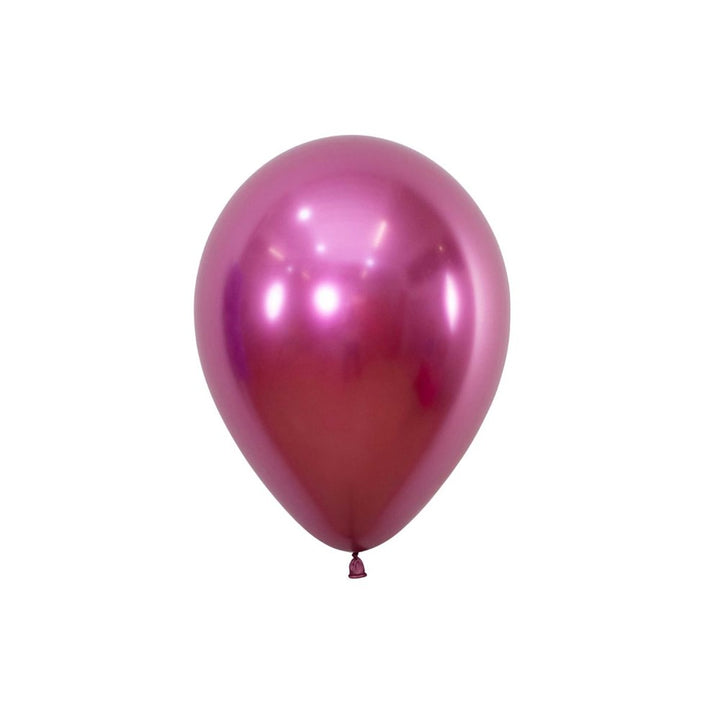 Single pink balloon on a white background