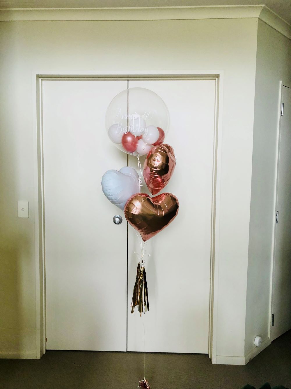 My Party Box Bubble Gum Balloon Bouquet with one bubble balloon with mini latex balloon inside and two metallic Rose Gold foil heart balloon, one White foil heart balloon 