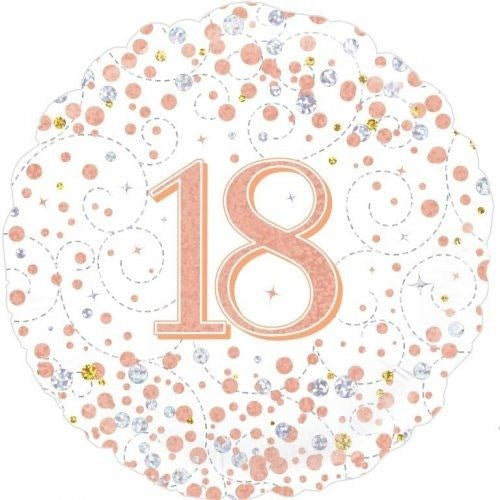 A round white party plate or decorative plate with a scalloped edge, featuring a large metallic rose-gold number 18 in the center, surrounded by scattered rose-gold, silver, and gold confetti dots and dashed swirl patterns.