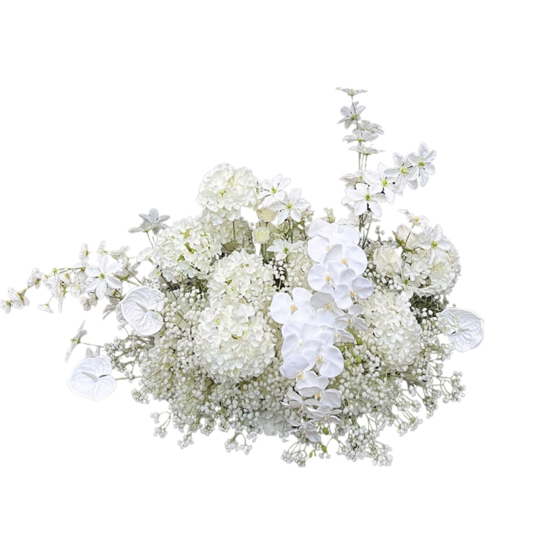 White floral arrangement with hydrangeas, roses, and baby's breath.