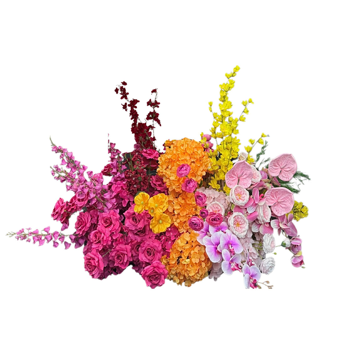 Colorful floral arrangement with roses, orchids, and hydrangeas.