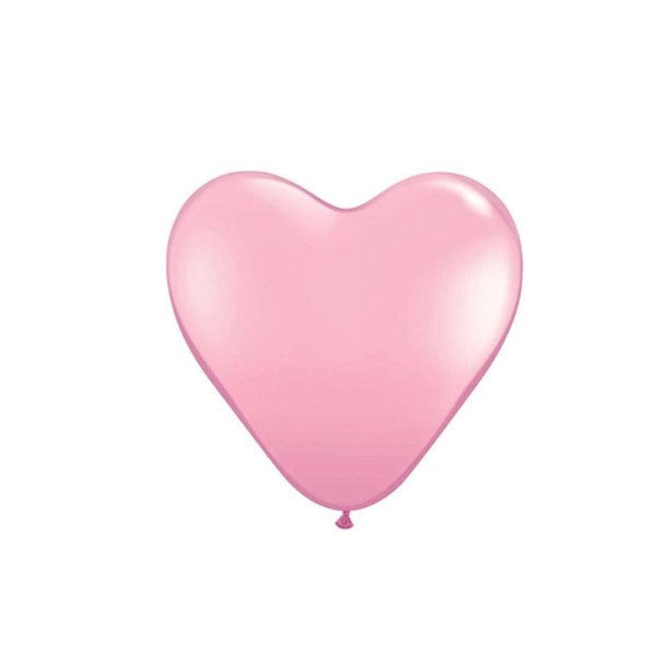 A soft light pink heart-shaped latex balloon isolated on a plain white background.