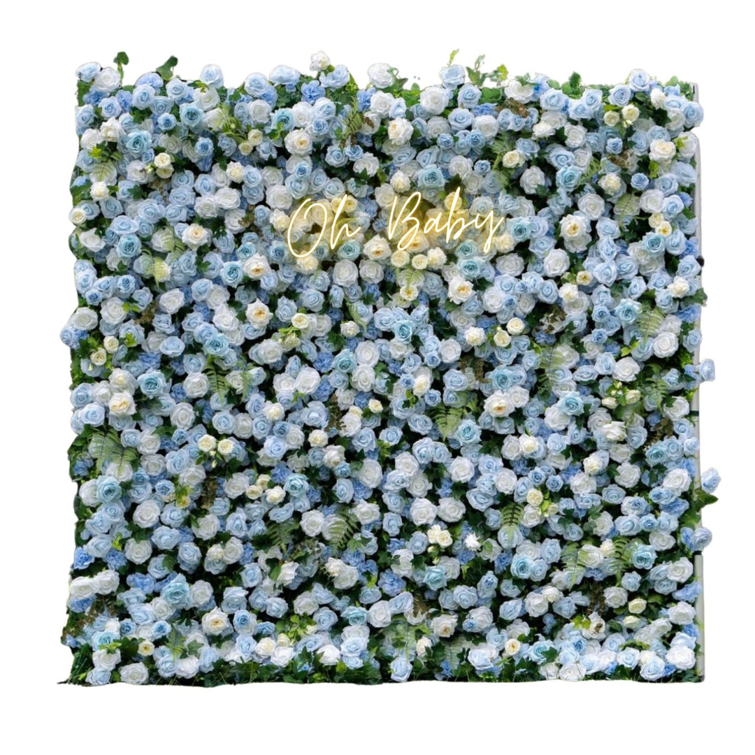 Floral wall with 'Oh Baby' text in gold on a white background