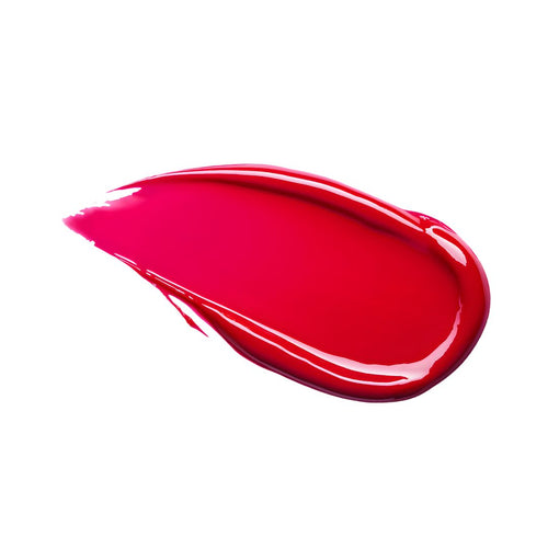 Red lipstick smear on white background.