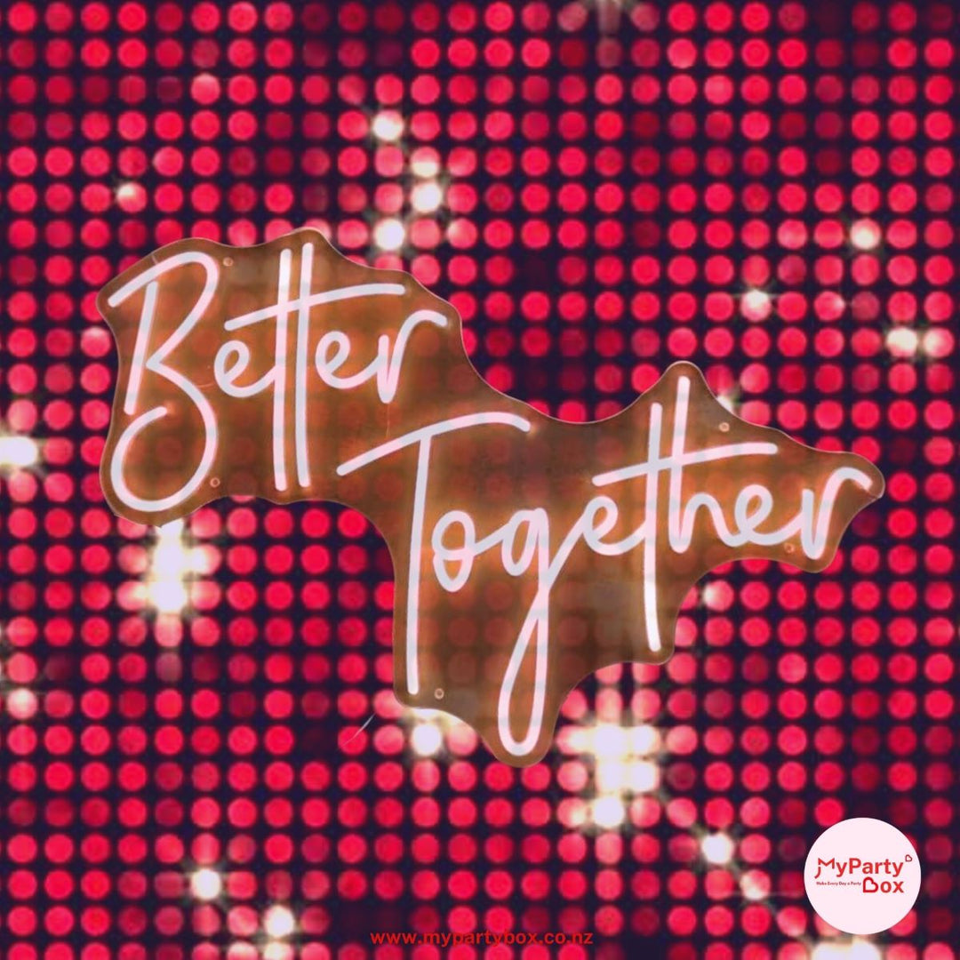Decorative sign with 'Better Together' text on a red polka dot background, featuring MyPartyBox branding.