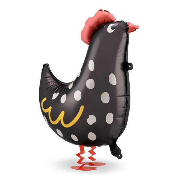 Inflatable rooster-shaped balloon with black body, white polka dots, red comb, and legs on a white background.
