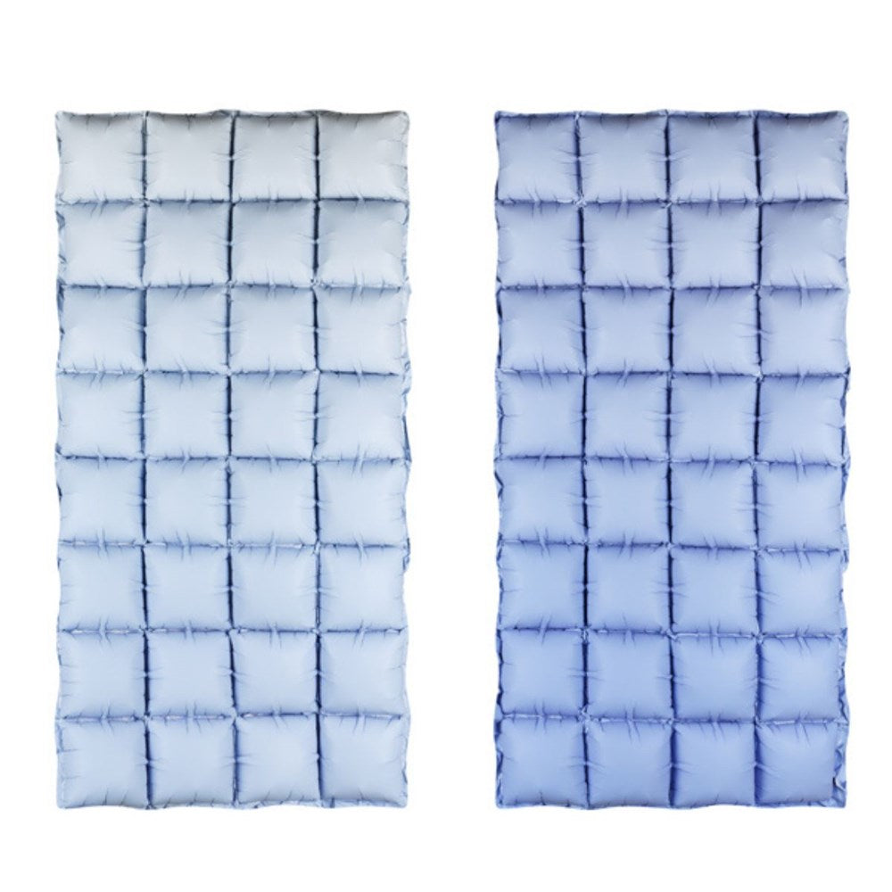 Two blue quilted mats with a grid pattern on a white background