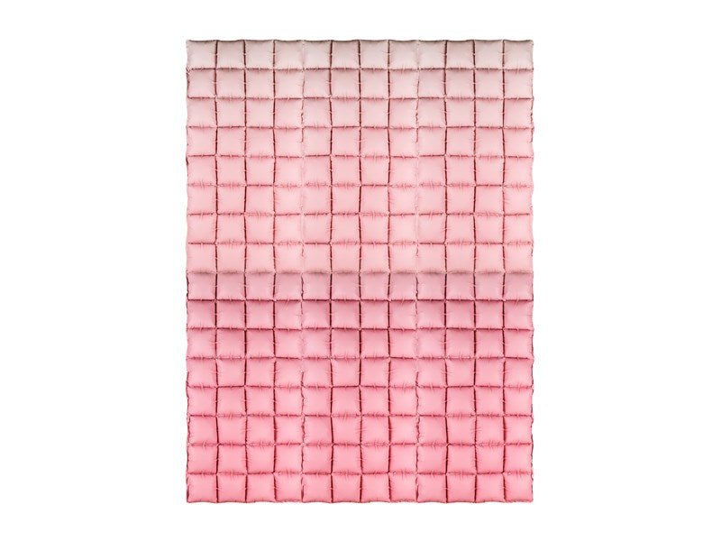 Pink woven blanket on a white background