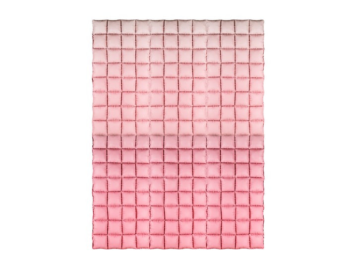Pink woven blanket on a white background