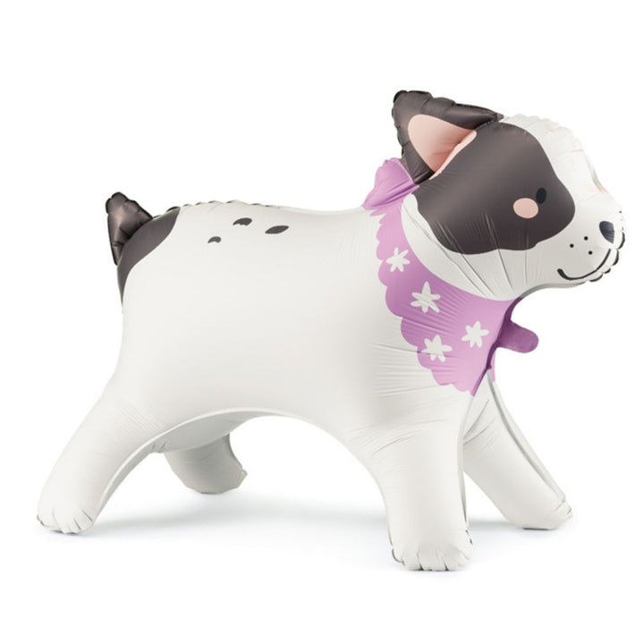 Stuffed animal dog with a purple bow on a white background
