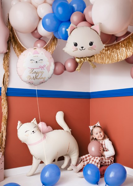 Children's birthday party with cat-shaped balloons and a child holding a pink balloon.