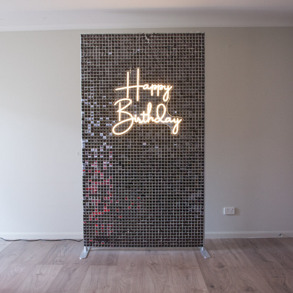 Black Shimmer Wall with Happy Birthday Neon Light