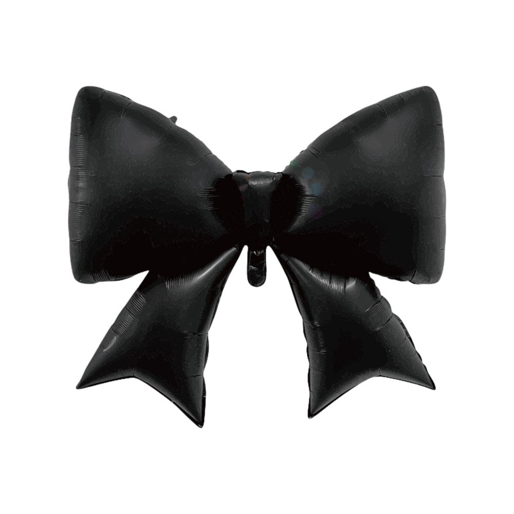 A single black foil balloon shaped like a large bow with two pointed tails, isolated on a plain white background.