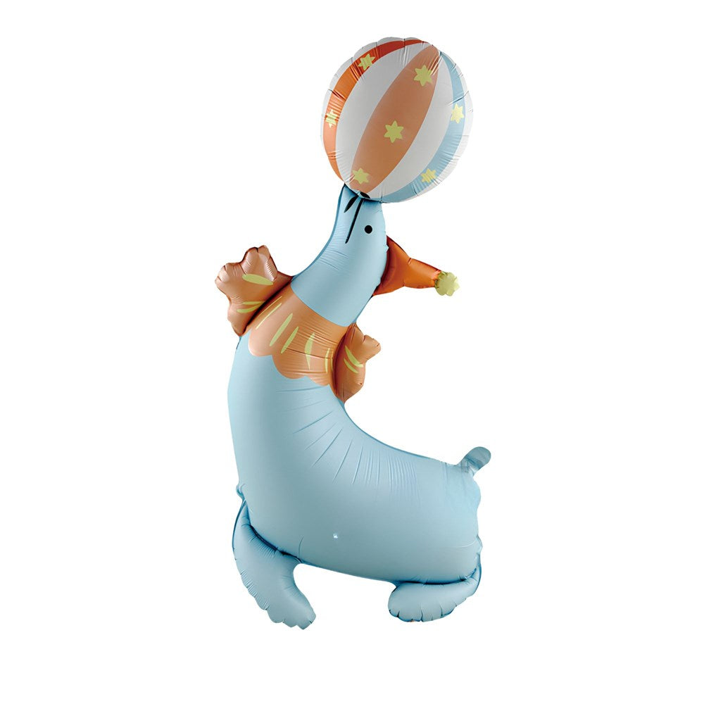 A light blue inflatable seal-shaped balloon balancing an orange, white, and blue striped ball on its nose, with small yellow star accents, isolated on a white background.