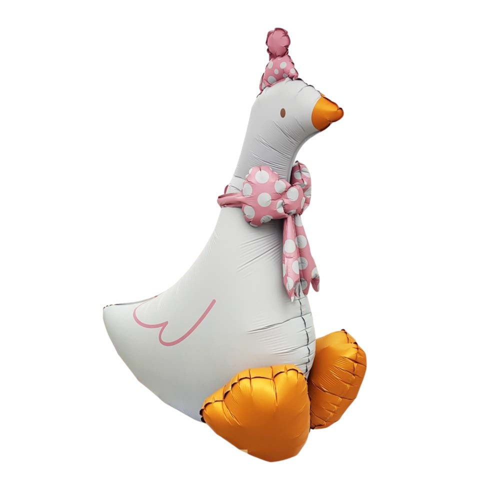 A large inflatable foil balloon shaped like a goose, with a white body, orange beak and feet, and pink polka-dot hat and scarf, isolated on a white background.