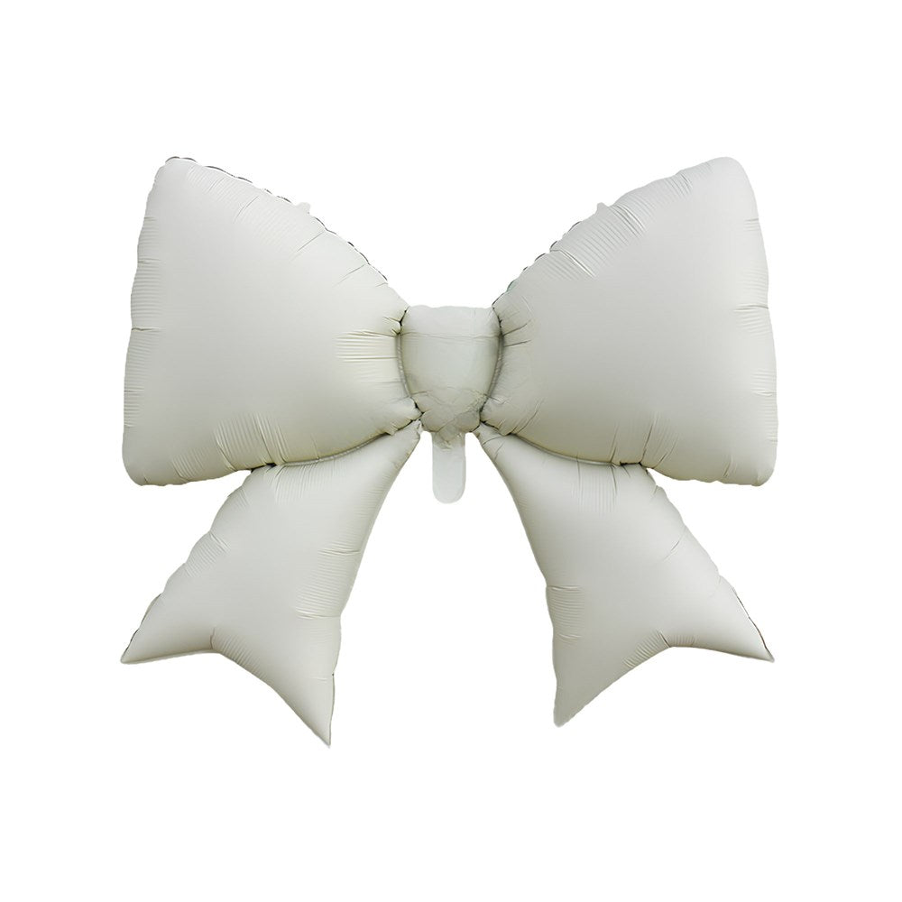 A large, oversized inflatable bow-shaped balloon in a warm off-white or cream color, isolated on a solid white background.