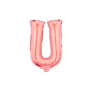 A metallic rose gold foil balloon in the shape of the letter U.
