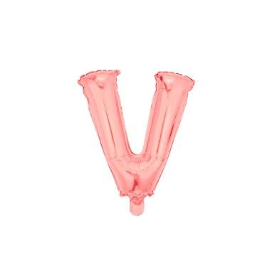 A rose gold foil balloon in the shape of the letter V.