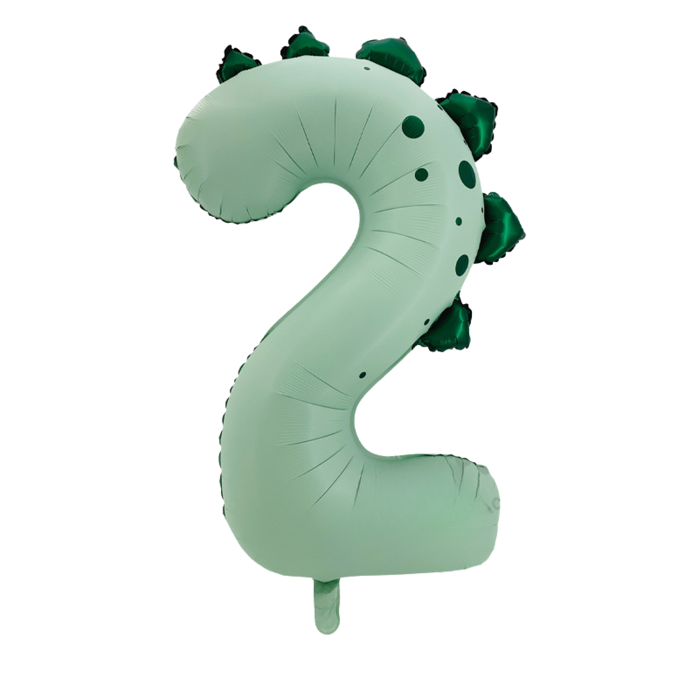 A novelty foil balloon shaped like the number 2, designed to look like a dinosaur with dark green spikes along the back, isolated on a white background.