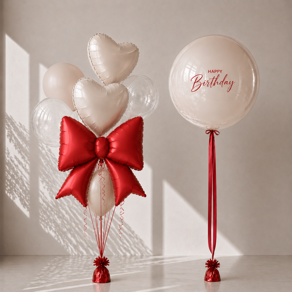 Balloon arrangement with heart shapes and a red bow, accompanied by a 'Happy Birthday' balloon on a neutral background.