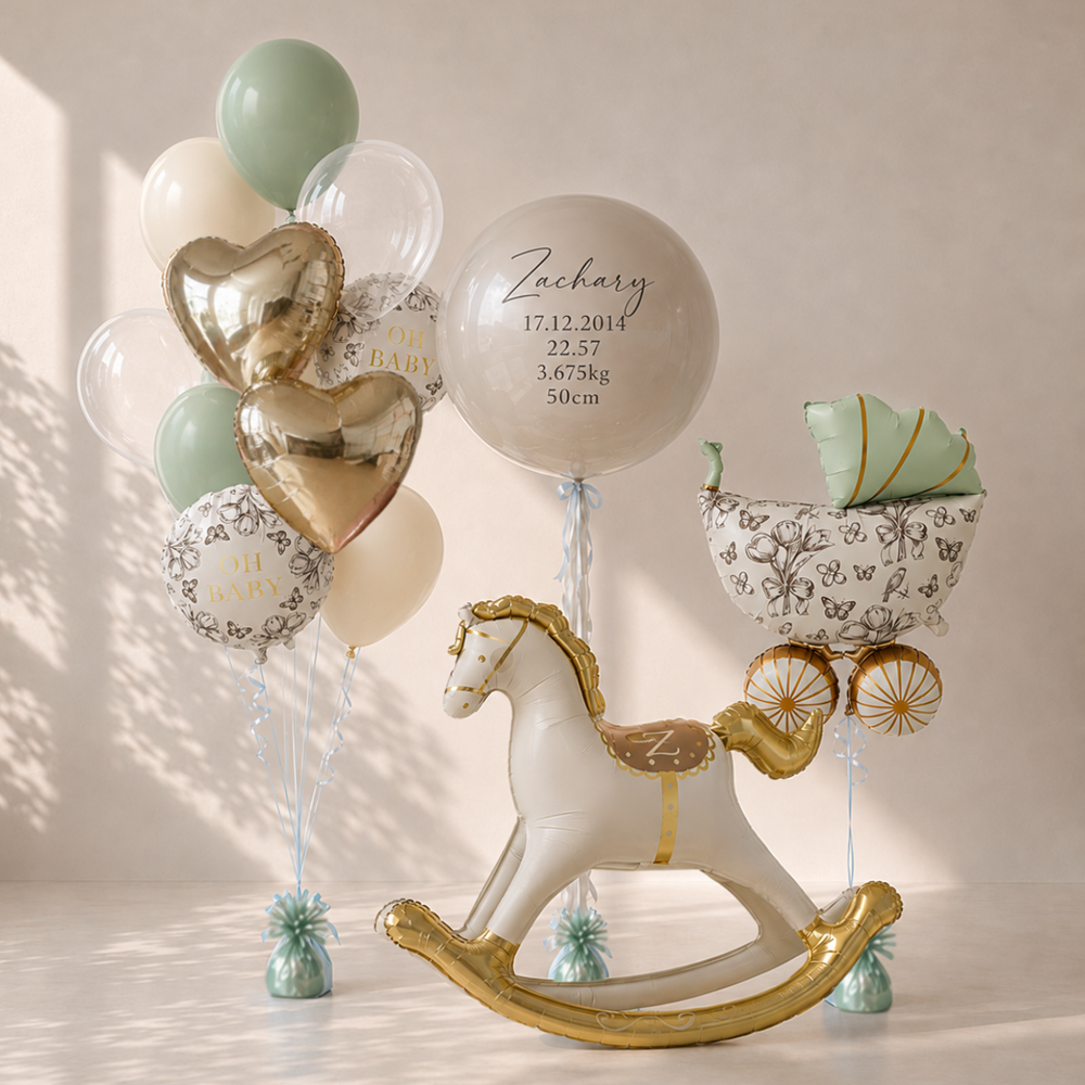 Decorative setup with balloons, rocking horse, and baby carriage on a light background