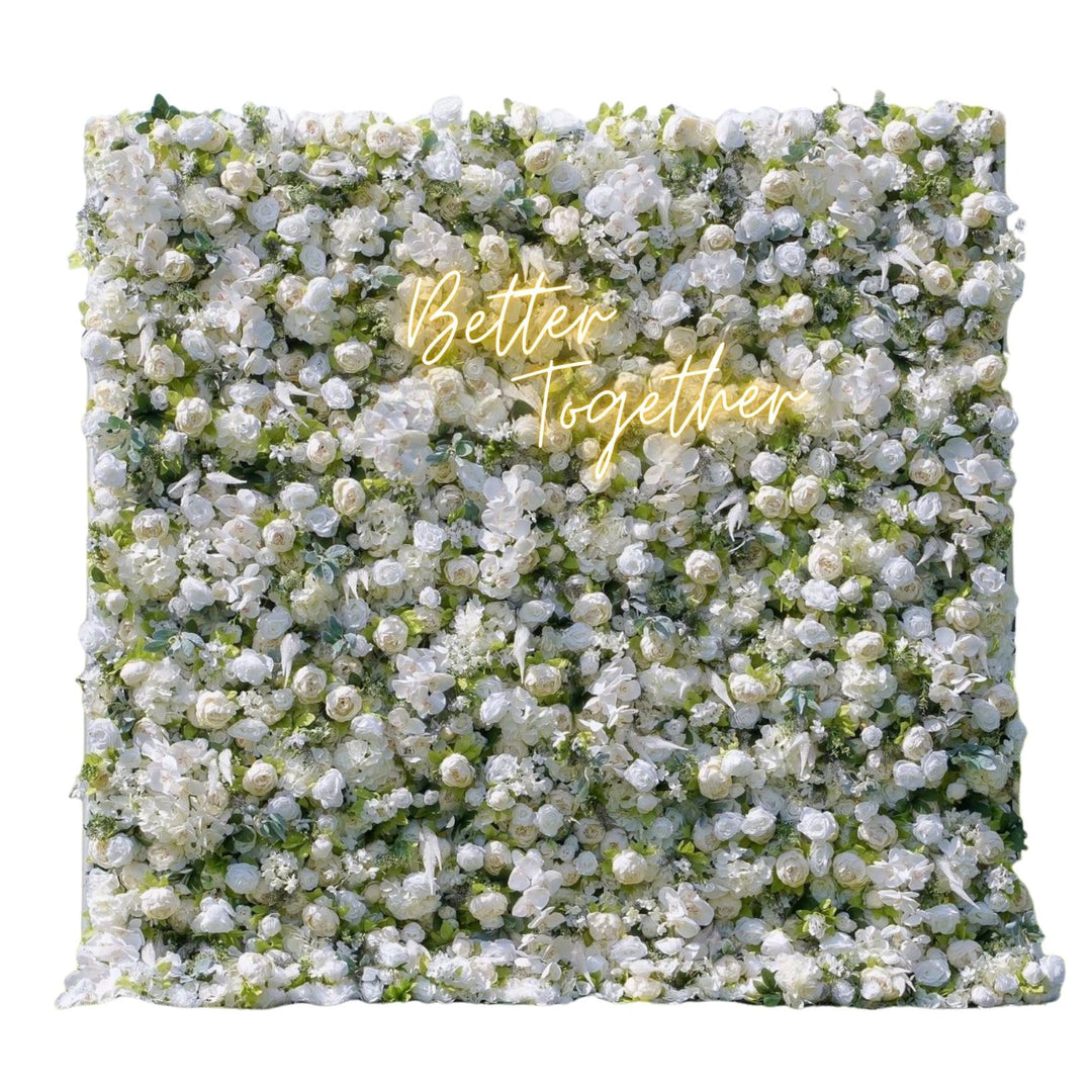 Floral wall with 'Better Together' text in gold on a white background