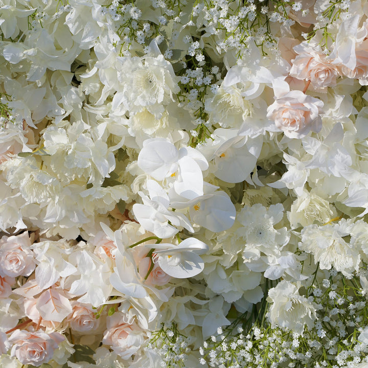 Close-up of a floral arrangement with white and light pink flowers.