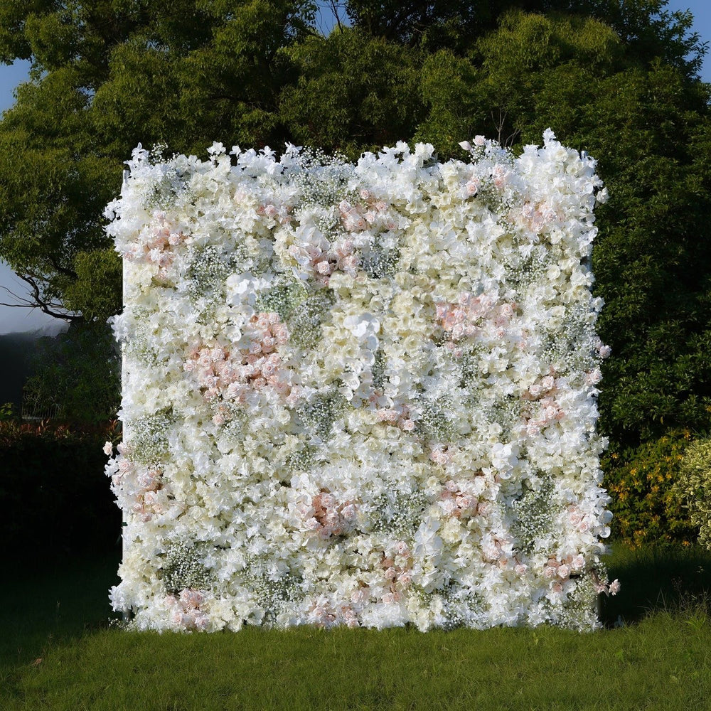 Floral wall backdrop with greenery in a natural setting