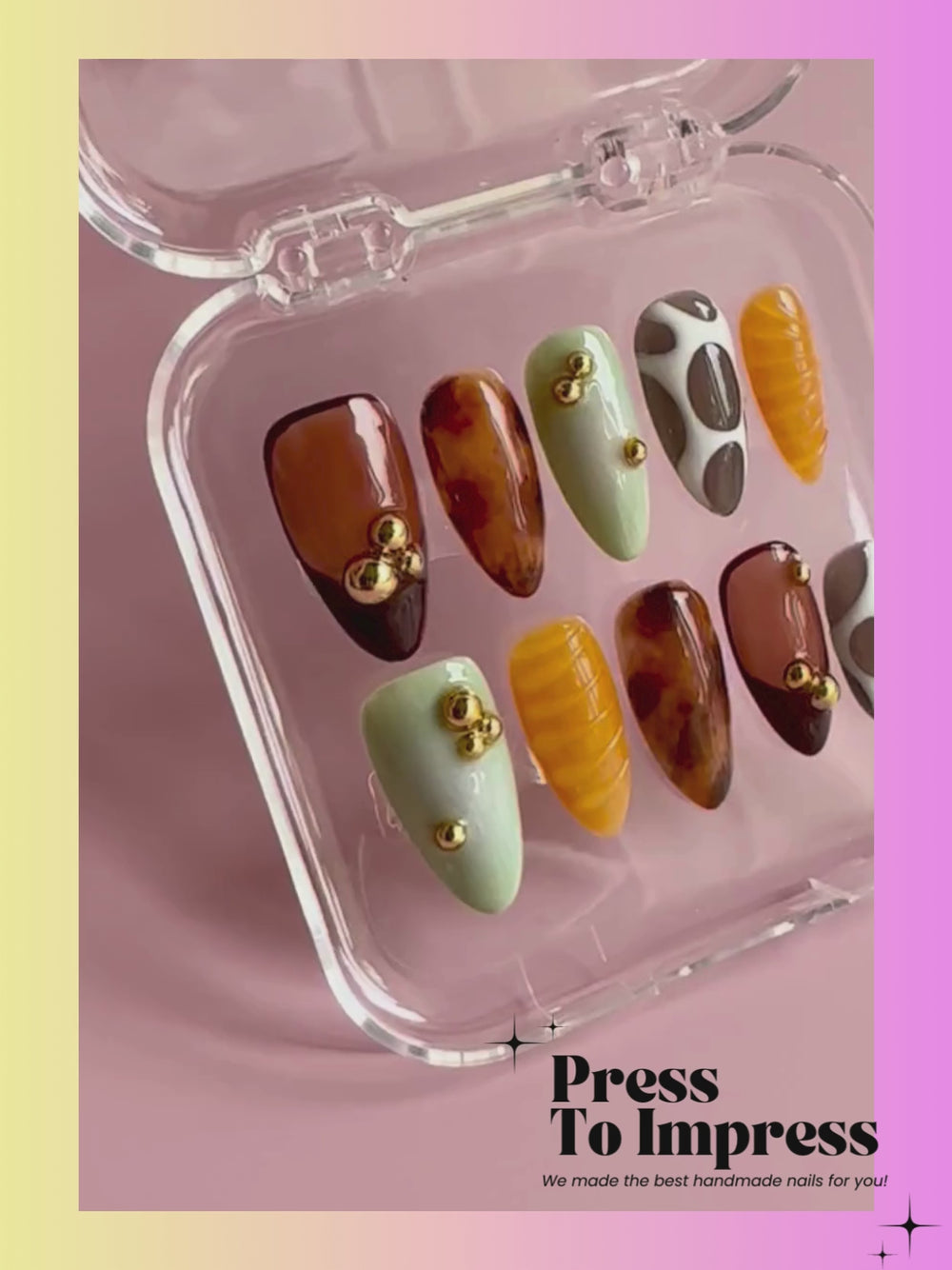Video shows A hand holds a clear plastic case displaying 10 press-on nails with autumn-themed designs, including brown, black, mint green, beige, and gold leaf patterns. The background is a soft pink-to-yellow gradient with the text 'Press To Impress' at the top