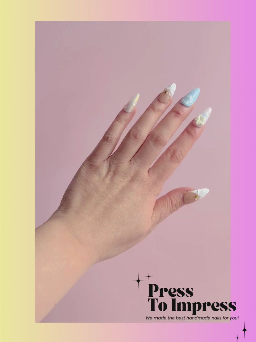 A video shows A hand holds a clear plastic case displaying ten decorative press-on nails with pastel designs including beige, light blue, white, and yellow star details. The background is a pink-to-yellow gradient with the text 'Press To Impress' and 'We made the best handmade nails for you!' in the top left.