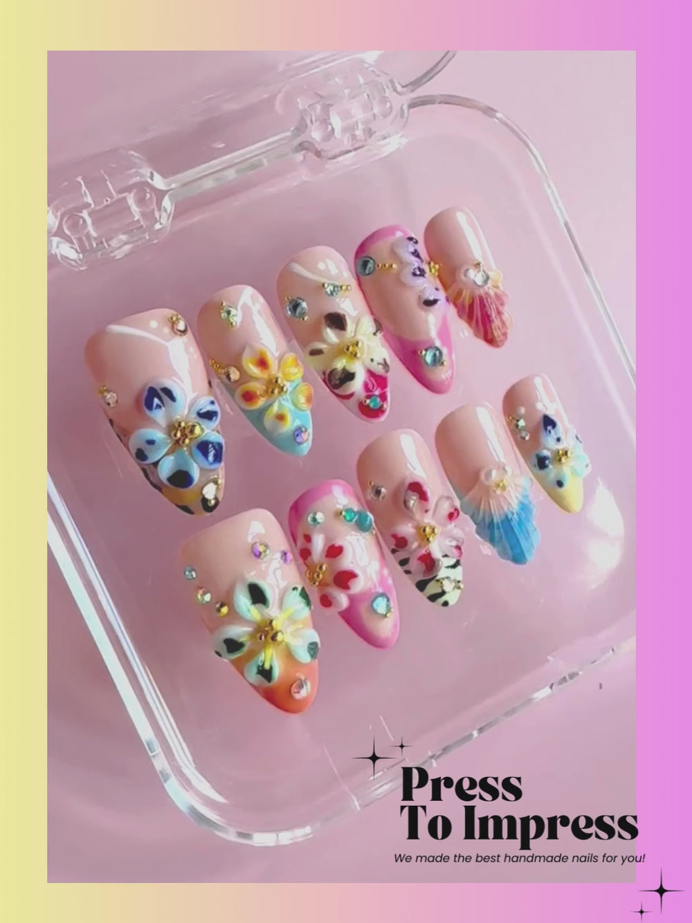 Video:A hand holds a clear plastic case displaying ten decorative press-on nails with pastel pink bases and colorful floral and shell designs. The background is a soft pink-to-yellow gradient with the text 'Press To Impress' and 'We made the best handmade nails for you!' at the top.