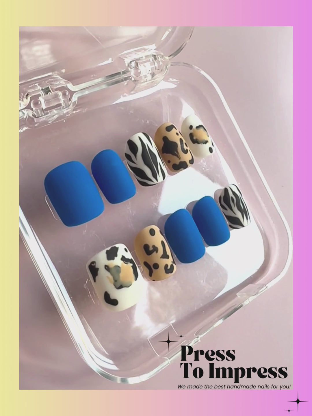 A Video shows A hand holds a clear plastic case displaying ten press-on nails against a pink-to-yellow gradient background. The nails feature solid royal blue, white with black zebra stripes, and beige-and-black leopard prints.