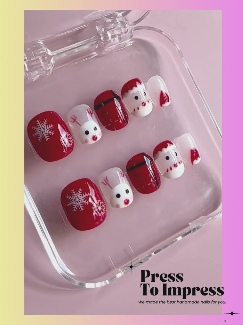 A Video shows A hand holds a clear plastic case displaying 10 Christmas-themed press-on nails. The nails feature red and white holiday designs including snowflakes, Santa faces, plaid patterns, and reindeer.