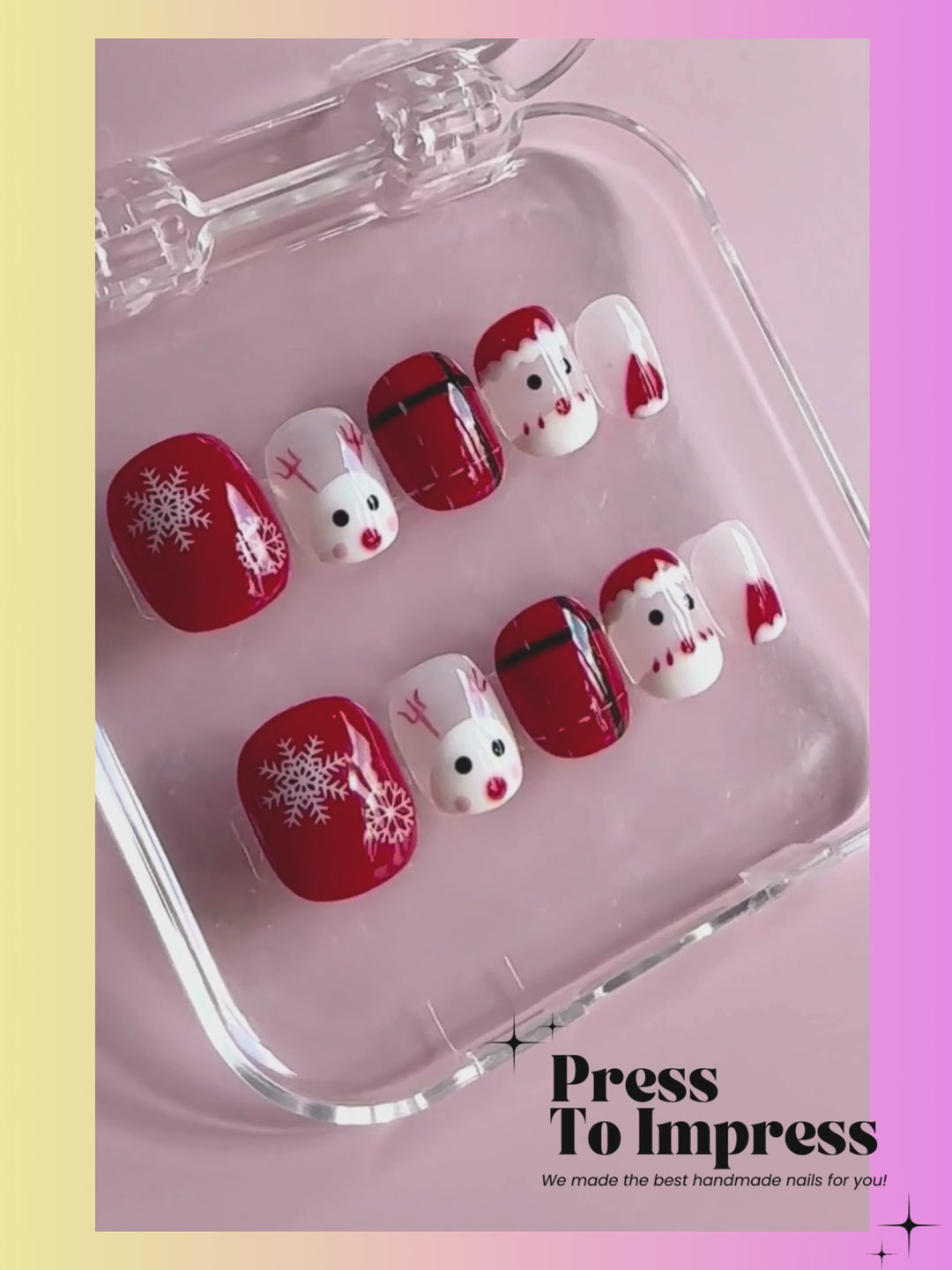 A Video shows A hand holds a clear plastic case displaying 10 Christmas-themed press-on nails. The nails feature red and white holiday designs including snowflakes, Santa faces, plaid patterns, and reindeer.