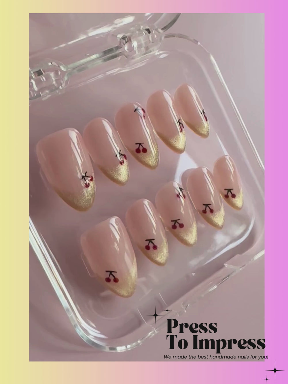 A Video shows A hand holds a clear plastic case containing 10 press-on nails with a nude pink to beige gradient and small red cherry and black bow designs. The background is a soft pink-to-yellow gradient with the text 'Press To Impress' at the top.
