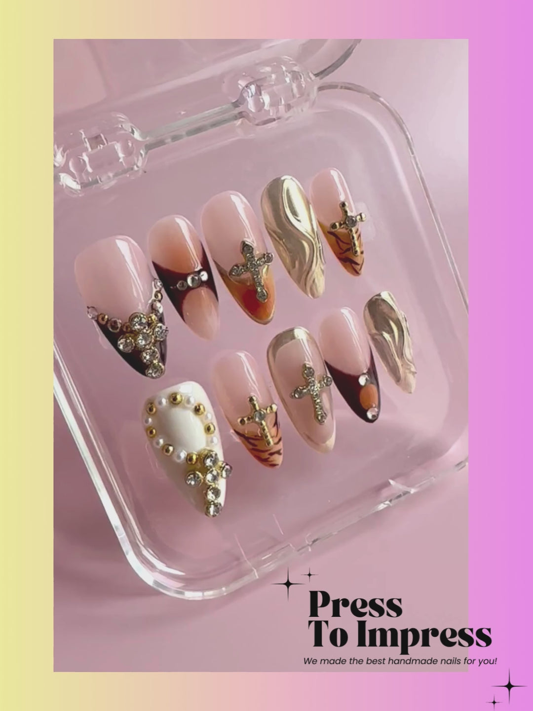 Video shows A hand holds a clear plastic case displaying ten press-on nails with a mix of nude, gold, brown, and rhinestone designs. The background is a soft pink-to-yellow gradient with the text 'Press To Impress' in the top left.