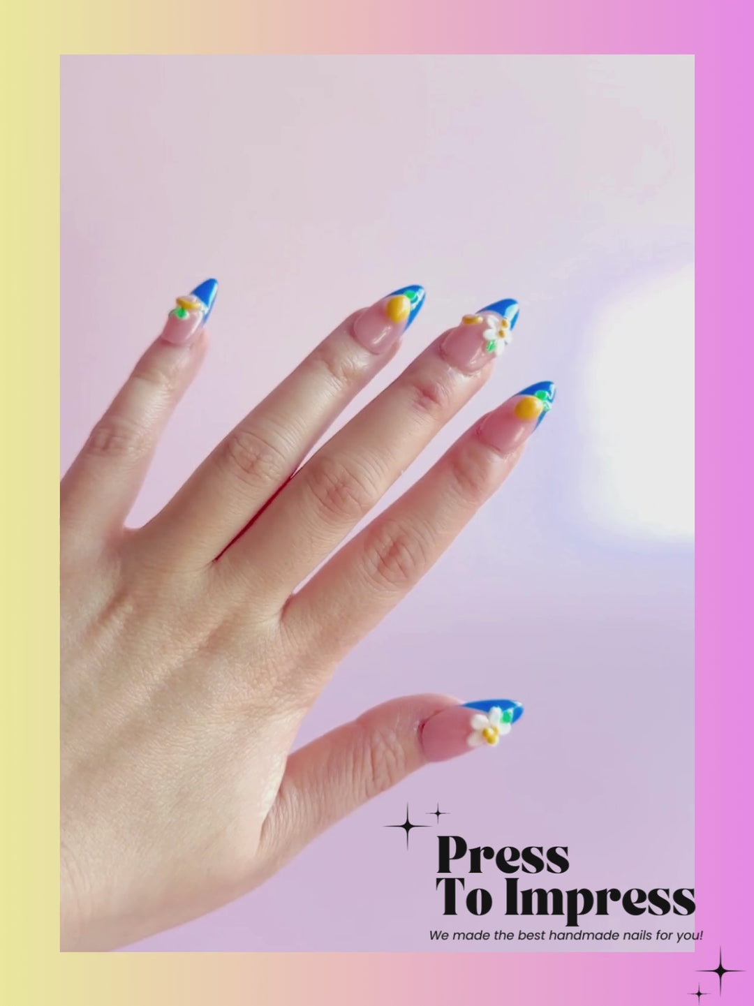 Video A hand holds a clear plastic case containing 10 false press-on nails with a peach-pink and blue French tip design, decorated with 3D white daisies, yellow cherries, and green leaves. The background is a soft pink-to-yellow gradient with 'Press To Impress' branding.