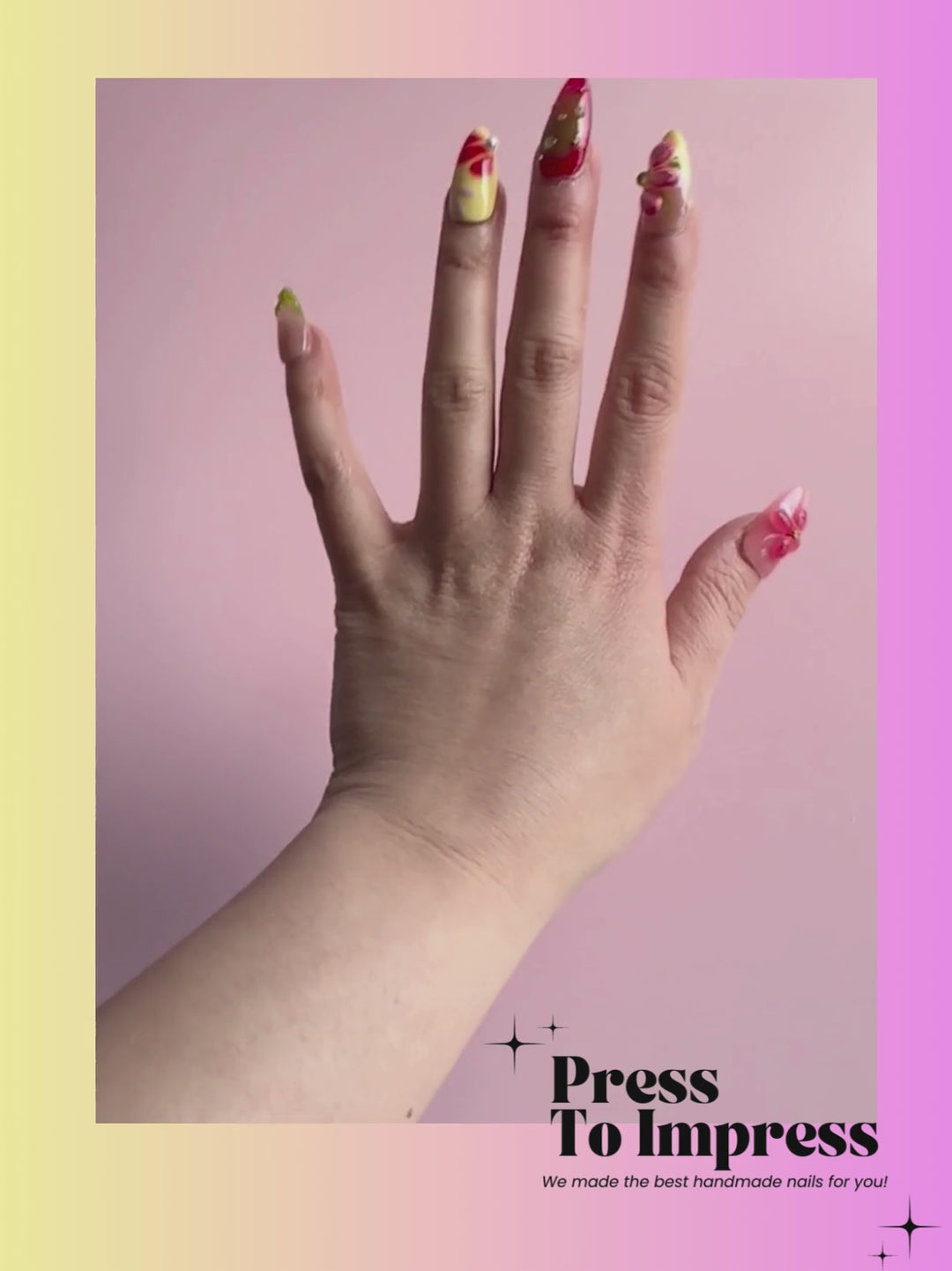 A Video Shows A hand holds a clear plastic case displaying ten artificial press-on nails with colorful floral and gradient designs, set against a pink-to-yellow gradient background with 'Press To Impress' branding.