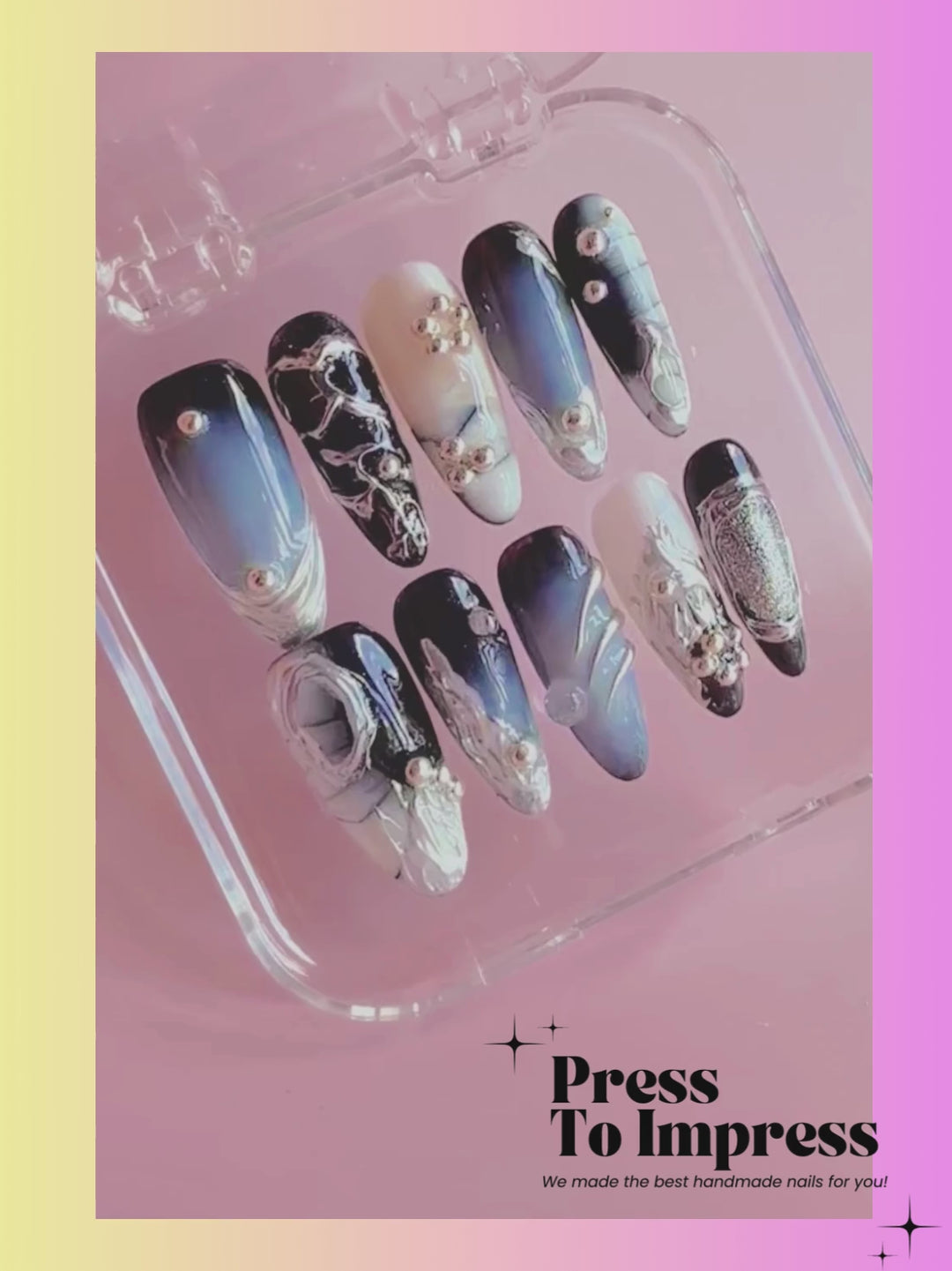 Video shows A hand holds a clear plastic case displaying 10 press-on nails with blue, black, white, and silver gradient designs and rhinestone accents. The background is a pink-to-yellow gradient with the text 'Press To Impress' in the top left.