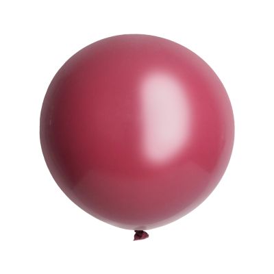 A round, matte burgundy maroon latex party balloon isolated on a white background.