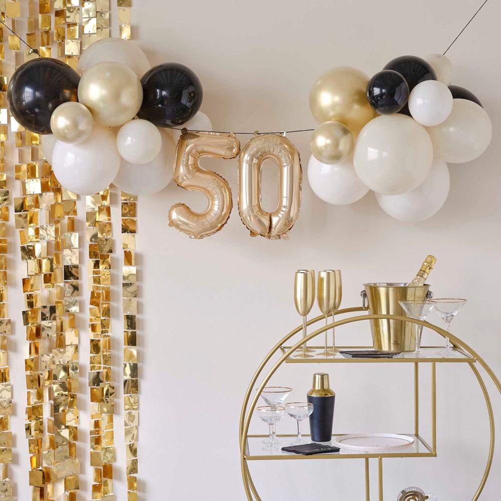 50th Birthday Milestone Balloon Bunting Decoration with Mini Foil Number balloons 50 & Black, White, White Sand , Chrome Gold Latex Balloons with Gold background