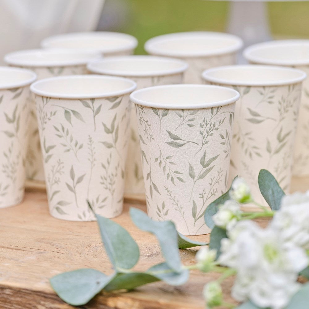 Ginger Ray Christening White & Green Paper Cups on wooden table