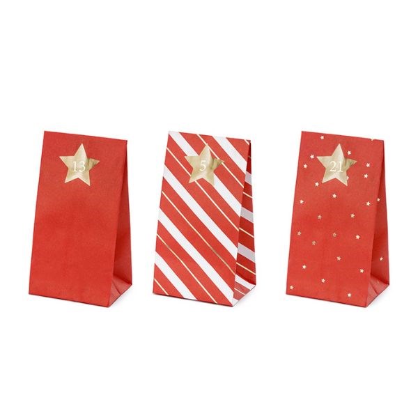 Three red and white Christmas advent treat bags with gold star numbered stickers.