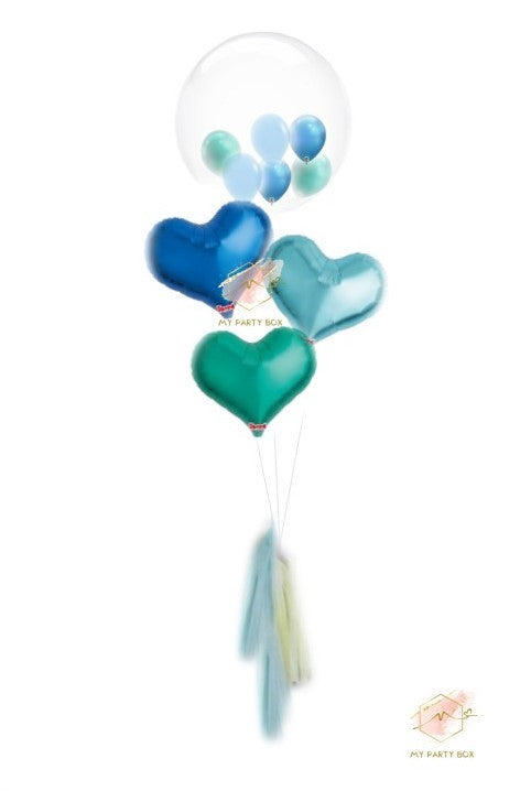 My Party Box Bubble Gum Balloon Bouquet with one bubble balloon with mini latex balloon inside and one dark blue foil heart balloon, one light blue foil heart balloon and Green Foil Heart Balloon